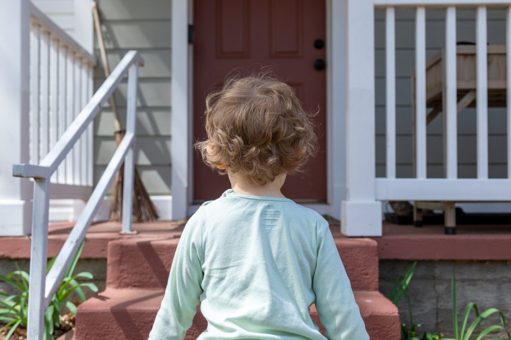 child walking to home daycare door